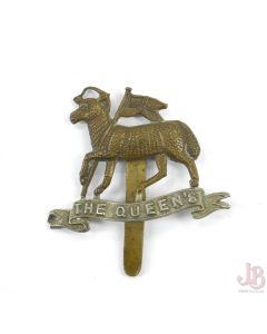 A vintage WW1 Cap badge - The Queen’s Regiment Royal West Surrey - two tone

